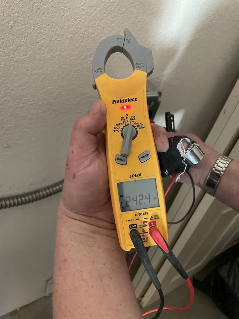 Voltage testing with clamp meter during Ceiling Fan Installation in Atoka